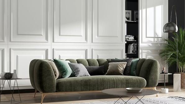 Green sofa in a modern living room with white walls and decorative elements.